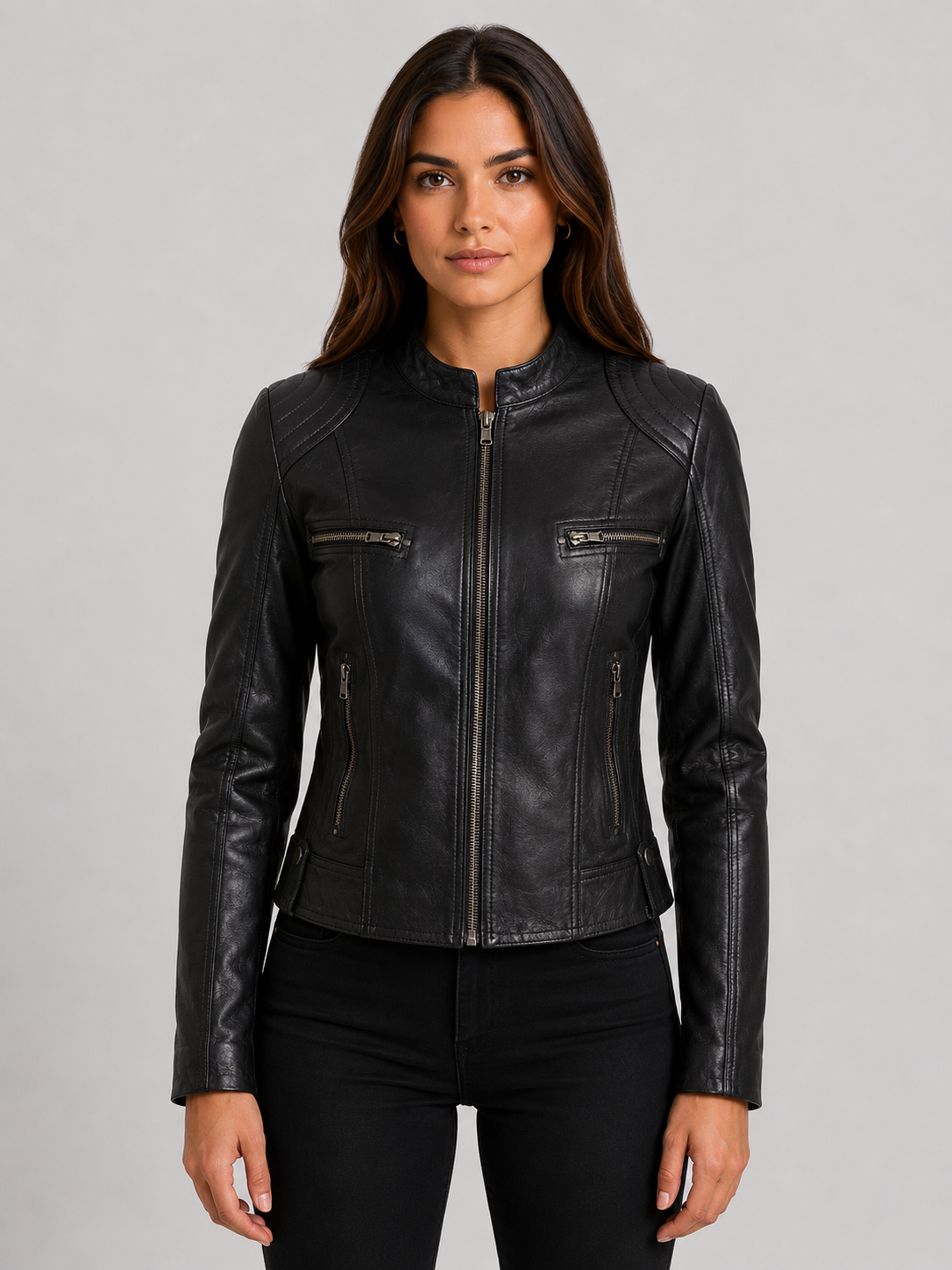 Women's black leather jacket showing tailored fit