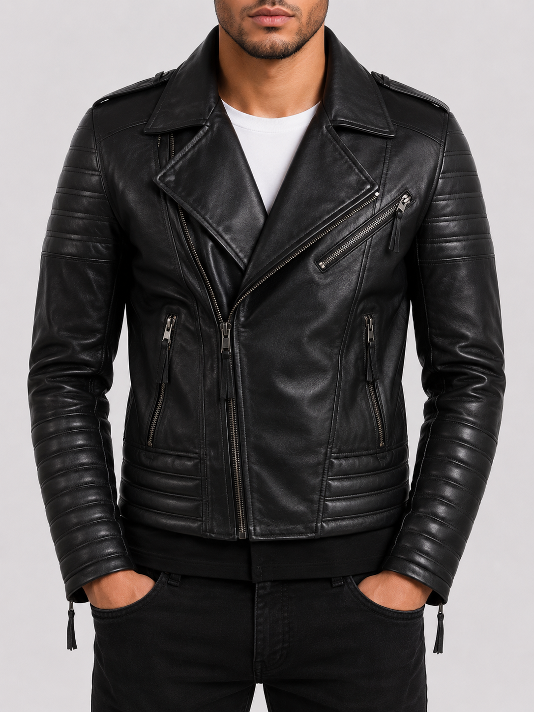 Man wearing a fitted black leather biker jacket showing the natural break-in and molded silhouette