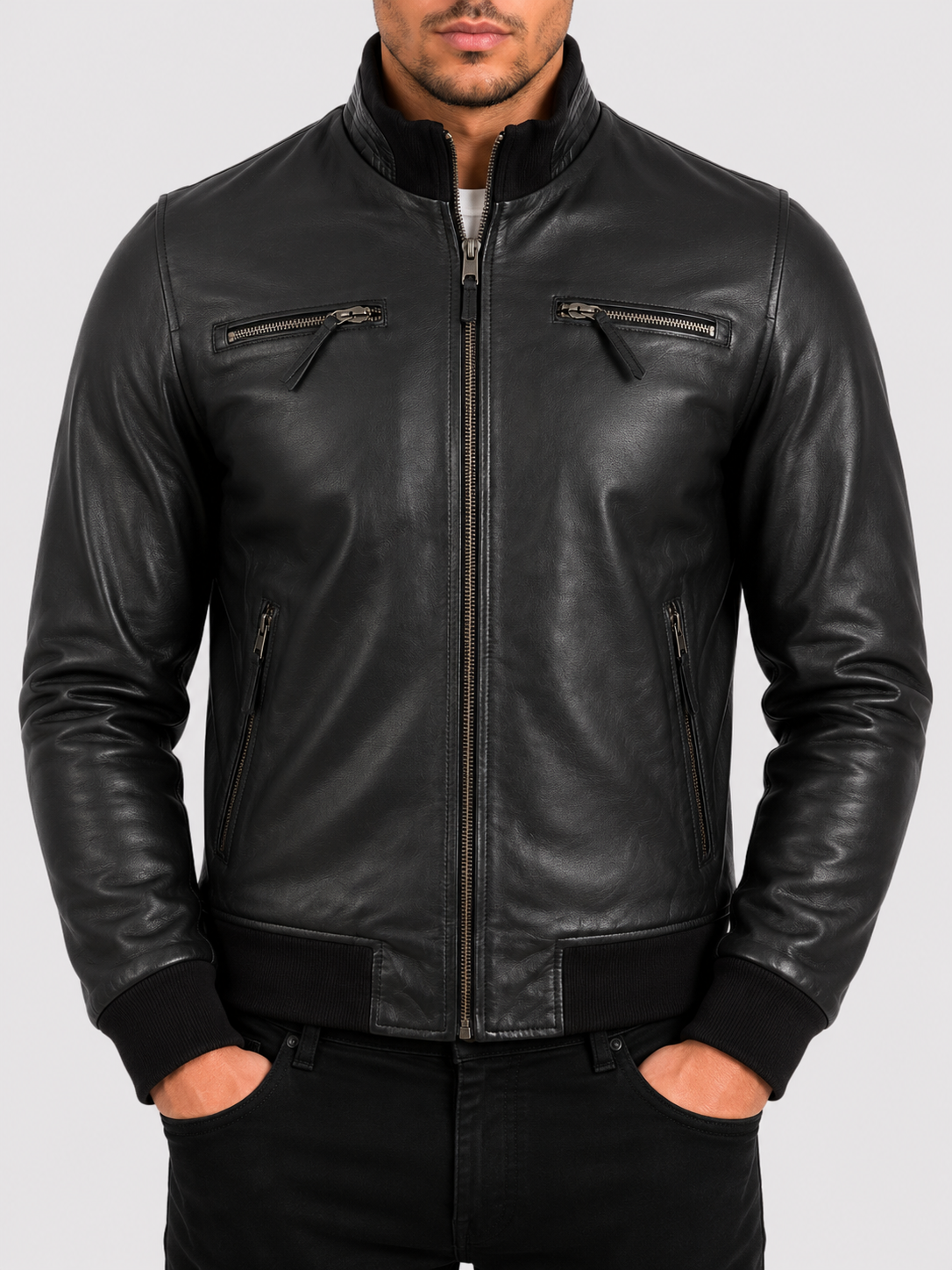 Man wearing a black leather bomber jacket showing well-maintained supple leather