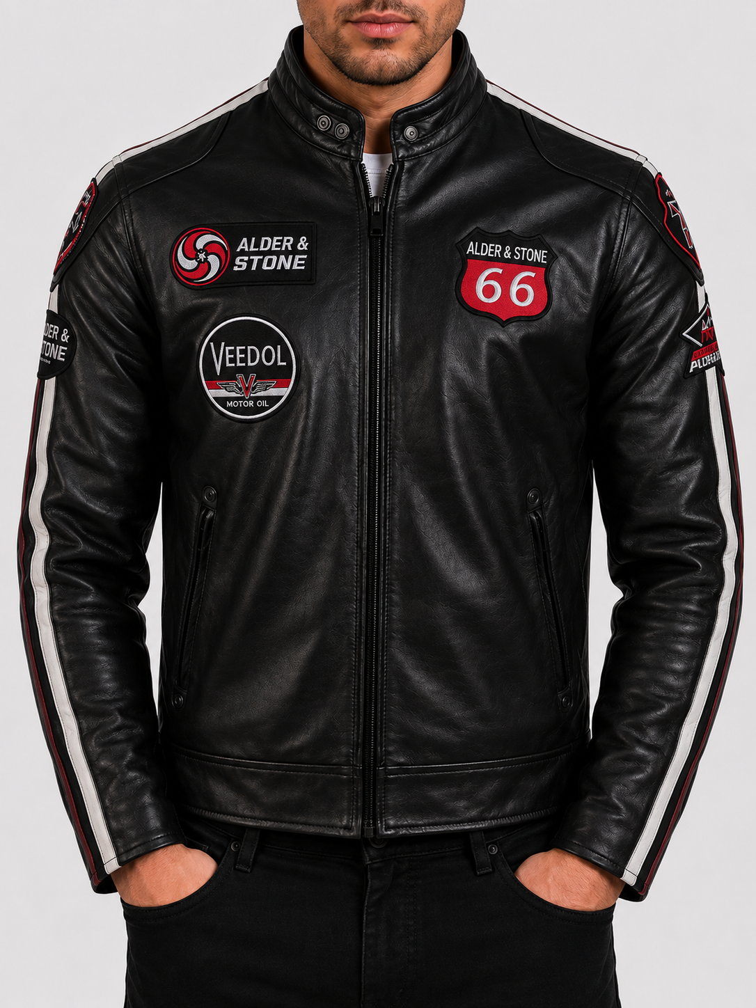 Man wearing a black leather biker jacket styled over a casual outfit showing how to wear leather jackets